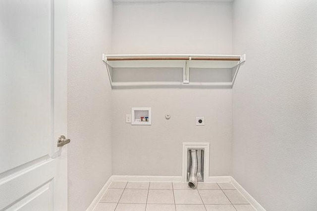 laundry room with gas dryer hookup, washer hookup, light tile patterned floors, and electric dryer hookup