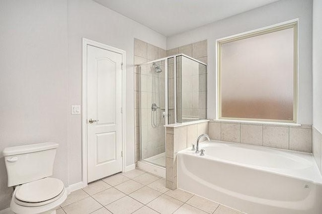 bathroom with separate shower and tub, tile patterned floors, and toilet