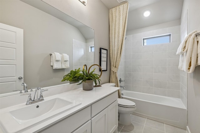 full bathroom with shower / tub combo, vanity, tile patterned floors, and toilet