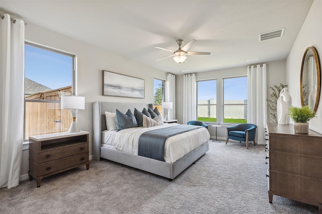 bedroom featuring ceiling fan and light colored carpet