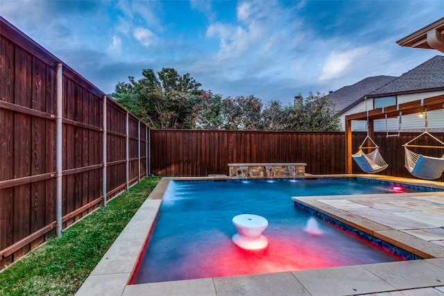 view of pool with pool water feature