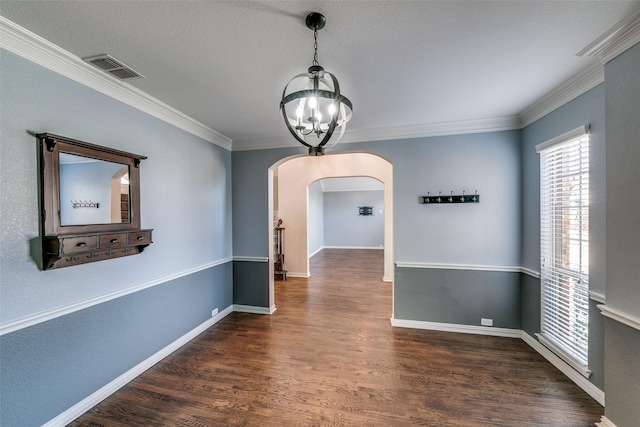 corridor featuring crown molding, dark hardwood / wood-style flooring, and an inviting chandelier