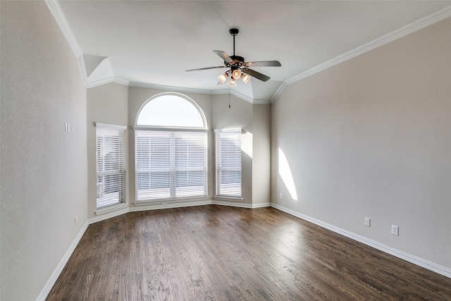 spare room with crown molding, lofted ceiling, and dark hardwood / wood-style flooring