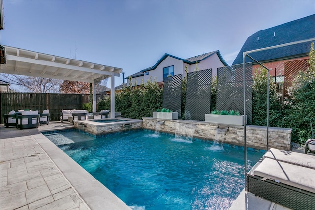 view of swimming pool with an in ground hot tub, pool water feature, and a patio