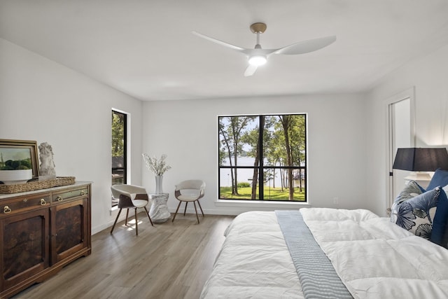 bedroom featuring light hardwood / wood-style flooring and ceiling fan