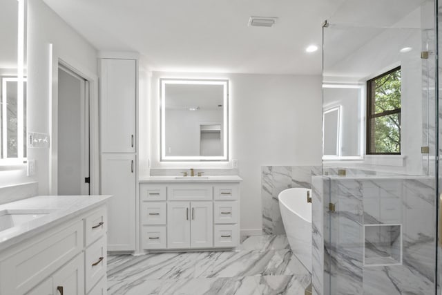 bathroom featuring plus walk in shower and vanity