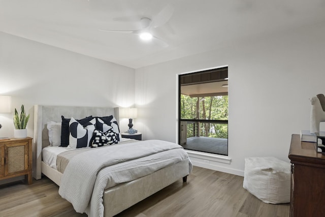 bedroom featuring light wood-type flooring and ceiling fan