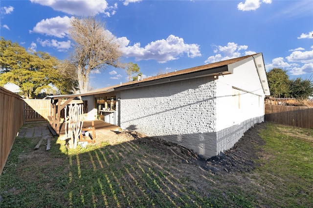 rear view of property featuring a yard