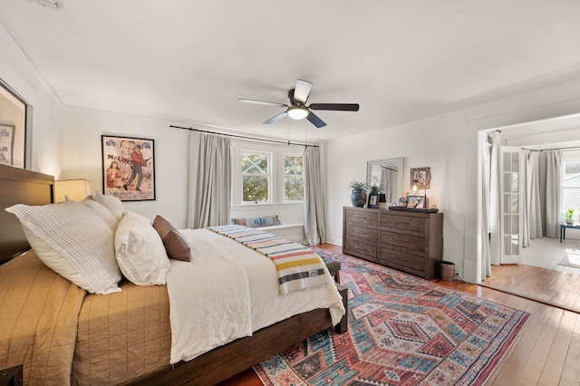 bedroom featuring hardwood / wood-style floors and ceiling fan