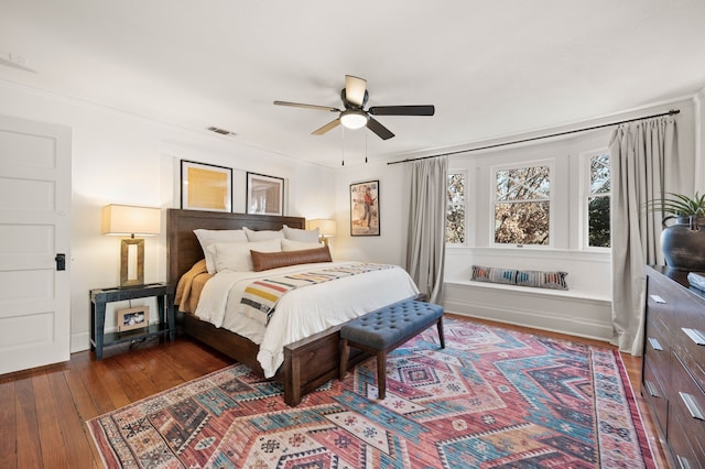 bedroom featuring dark hardwood / wood-style flooring and ceiling fan