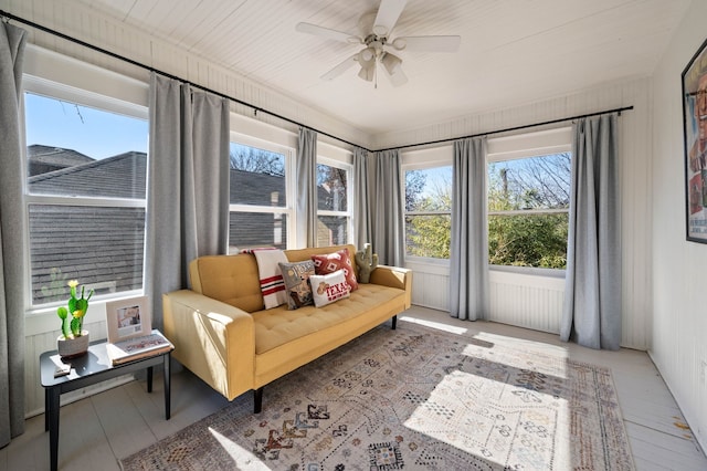 sunroom / solarium with ceiling fan and plenty of natural light