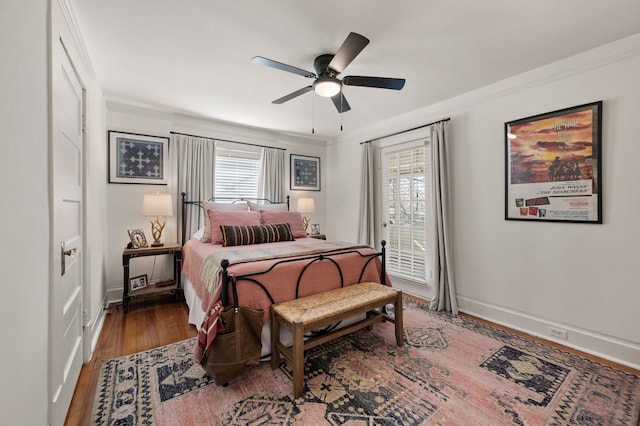 bedroom featuring crown molding, ceiling fan, and hardwood / wood-style floors