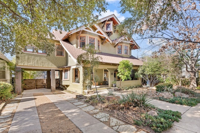 craftsman house with a carport and a porch