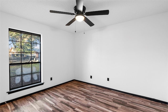 empty room with hardwood / wood-style flooring