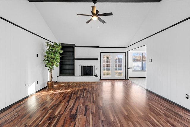 unfurnished living room featuring ceiling fan, wood-type flooring, a brick fireplace, vaulted ceiling, and french doors