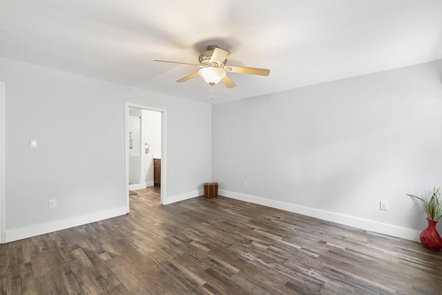 spare room featuring ceiling fan and dark hardwood / wood-style flooring