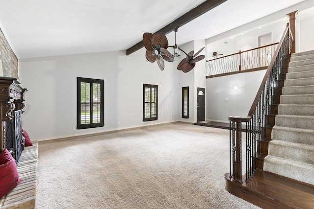 living room featuring ceiling fan, high vaulted ceiling, beam ceiling, and carpet floors