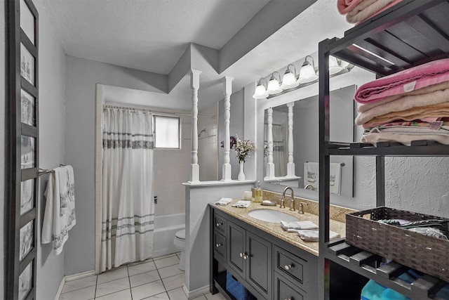 full bathroom with shower / tub combo with curtain, tile patterned floors, toilet, a textured ceiling, and vanity