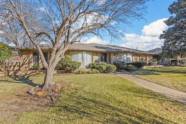 ranch-style house featuring a front lawn