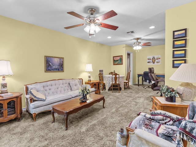 living room with ceiling fan and carpet flooring