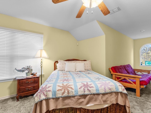 carpeted bedroom with lofted ceiling and ceiling fan