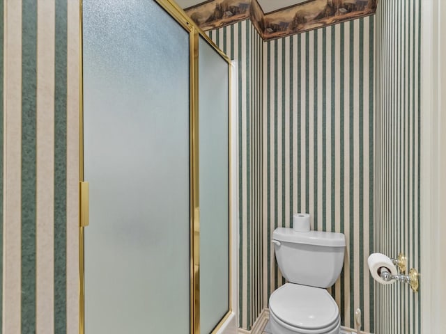 bathroom with toilet and walk in shower