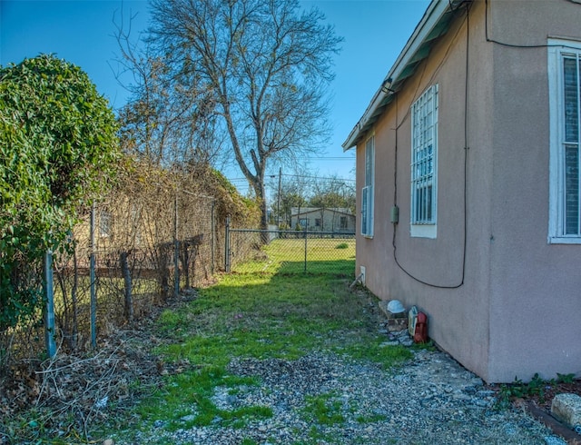 view of property exterior with a yard