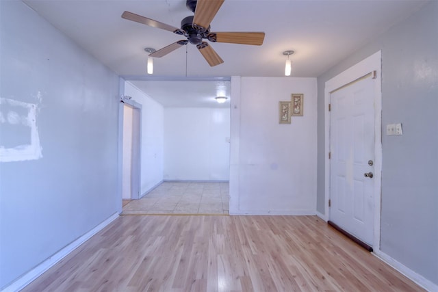 empty room featuring light hardwood / wood-style floors and ceiling fan