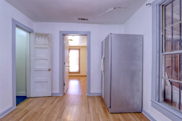 hall with light hardwood / wood-style flooring