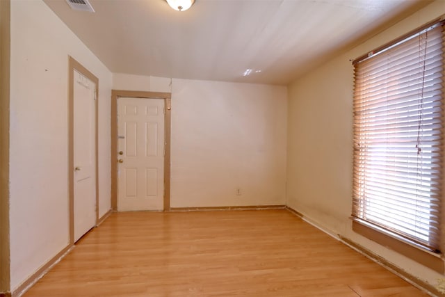 spare room featuring light hardwood / wood-style flooring