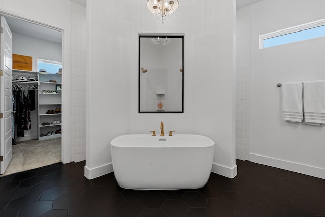 bathroom featuring tile patterned flooring and independent shower and bath