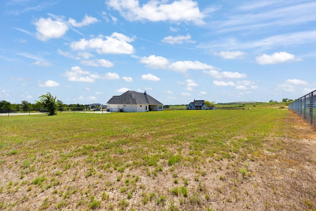 view of yard with a rural view