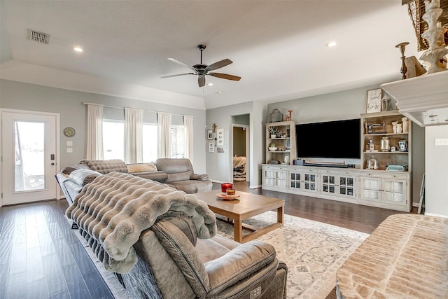 living room featuring ceiling fan and hardwood / wood-style floors