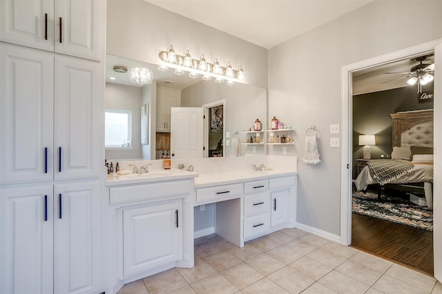 bathroom with tile patterned flooring, vanity, and ceiling fan