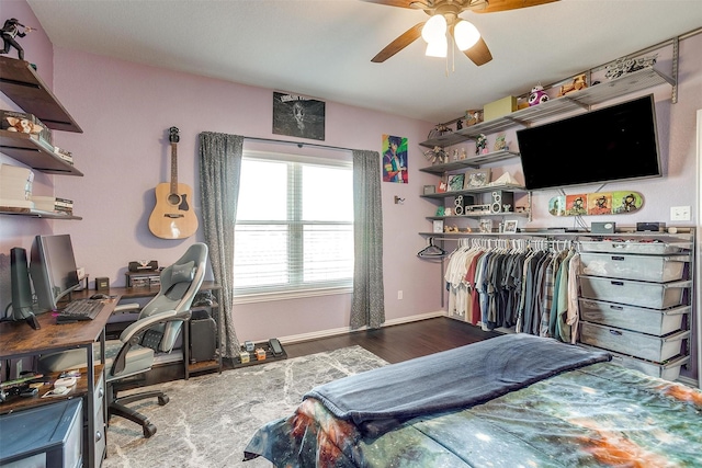 bedroom featuring hardwood / wood-style floors and ceiling fan