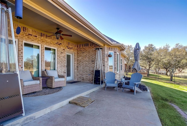 view of patio featuring ceiling fan