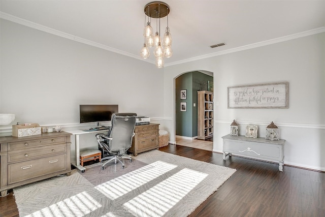 home office featuring ornamental molding, hardwood / wood-style floors, and an inviting chandelier