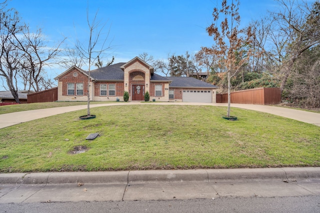 ranch-style house featuring a garage and a front lawn