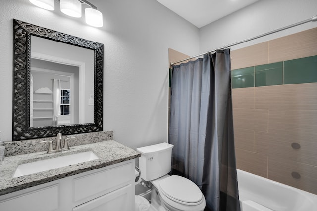 full bathroom with vanity, toilet, and shower / bath combo with shower curtain