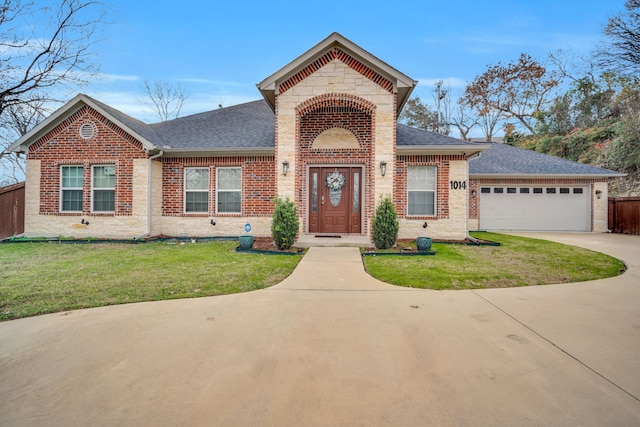 view of front of house featuring a garage and a front lawn