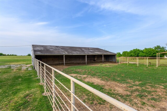 view of stable featuring a rural view