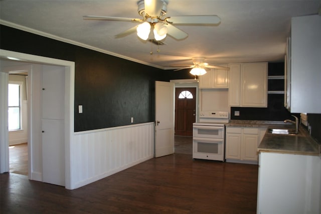 kitchen featuring white cabinetry, sink, dark hardwood / wood-style flooring, and range with two ovens