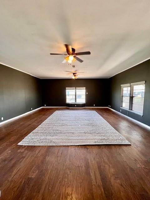 unfurnished room featuring hardwood / wood-style flooring and ceiling fan