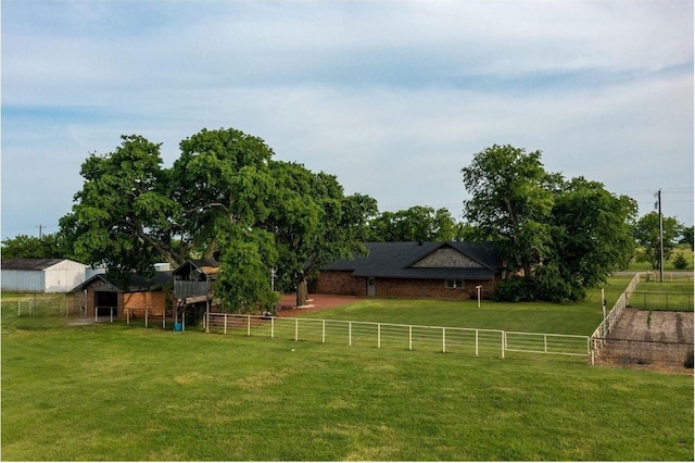 view of yard with a rural view