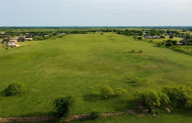 birds eye view of property with a rural view