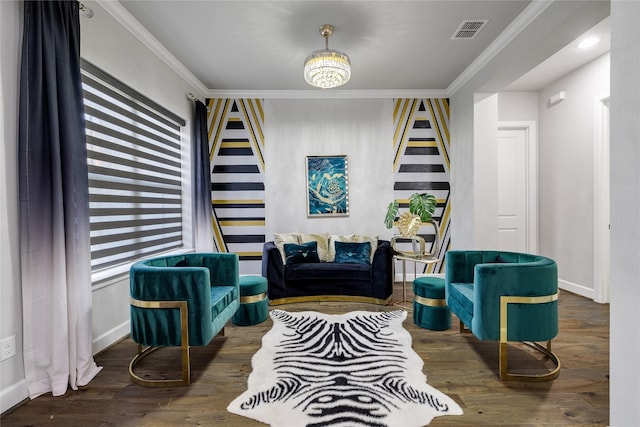 sitting room with dark hardwood / wood-style flooring and ornamental molding