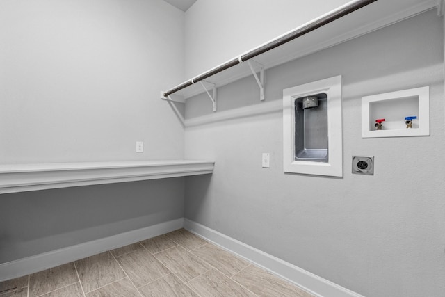 laundry room featuring laundry area, hookup for a washing machine, baseboards, and hookup for an electric dryer