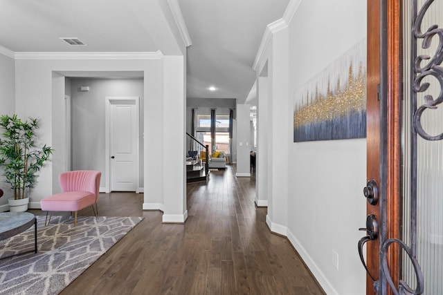 entrance foyer with baseboards, visible vents, dark wood-style floors, stairs, and crown molding