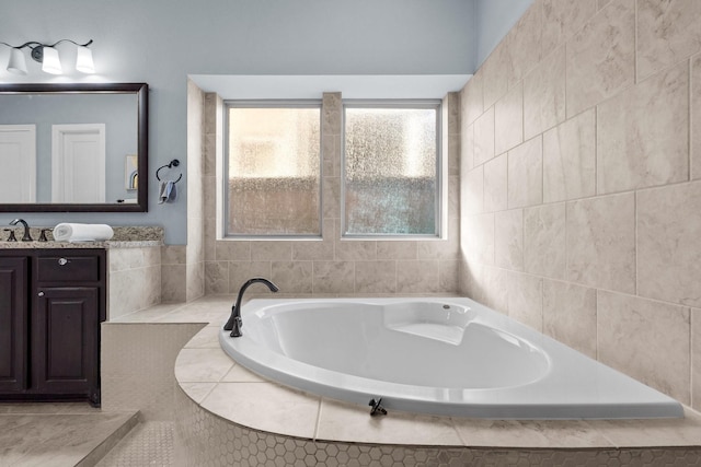 bathroom featuring a bath and vanity