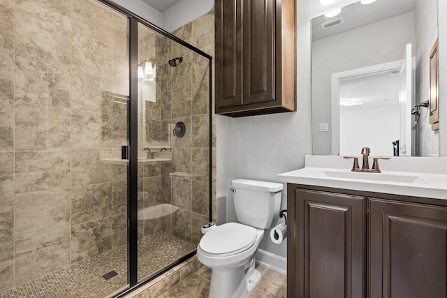 full bath with toilet, a stall shower, visible vents, and vanity